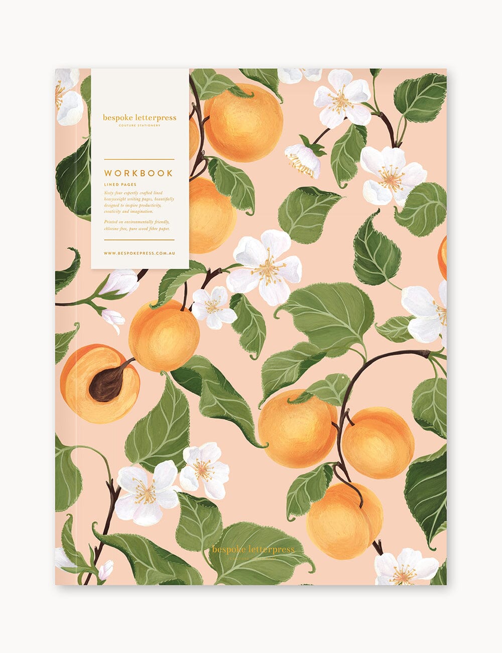 Flat lay of the Bespoke Letterpress Peaches Workbook, featuring a luscious illustration of golden apricots and white blossoms on a soft peach background, wrapped with an elegant branded belly band.