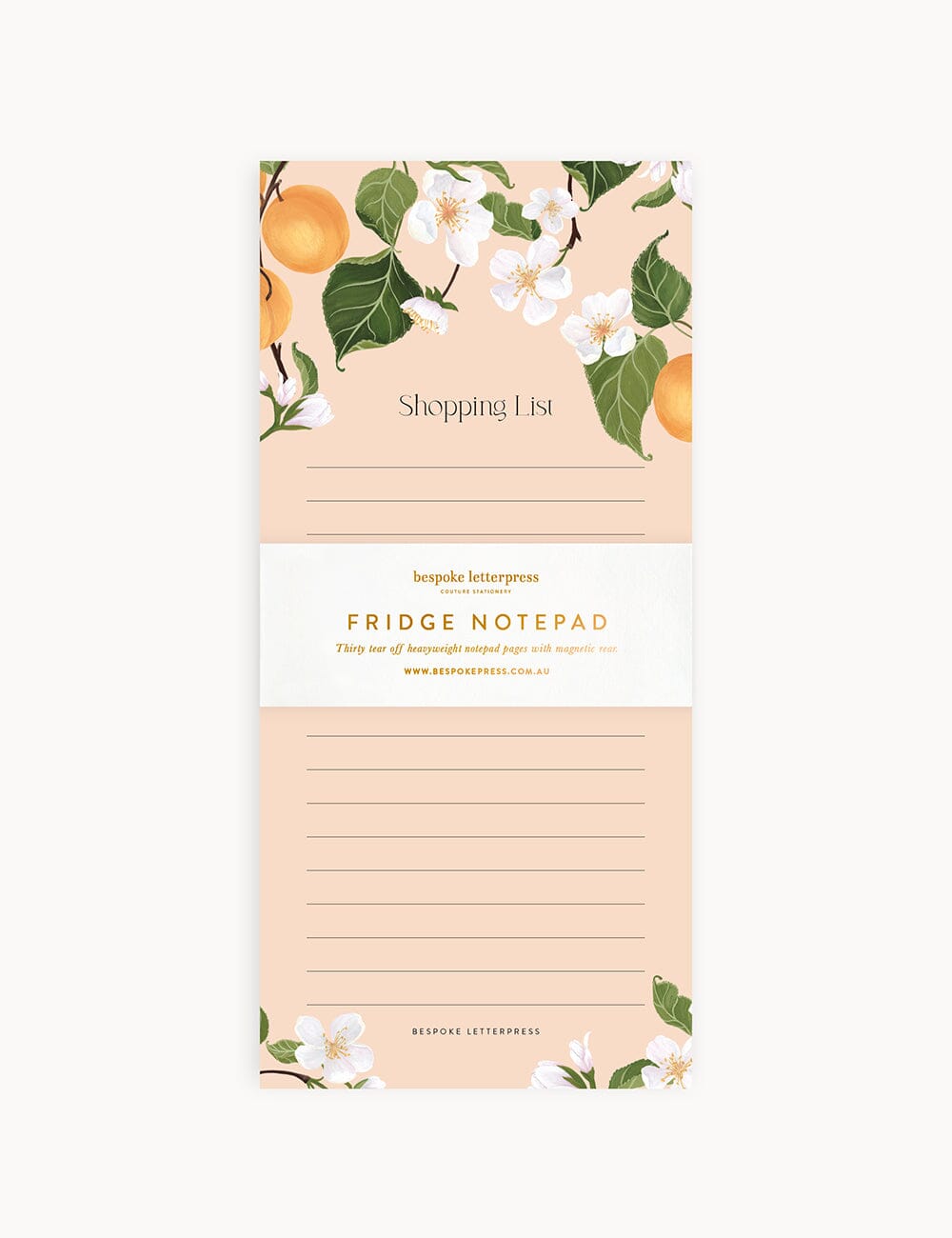 Flat lay of the Peaches Shopping List DL Notepad by Bespoke Letterpress, featuring delicate peach fruit and blossom illustrations on a blush-toned background, with a gold foil printed bellyband and lined pages for daily notes.